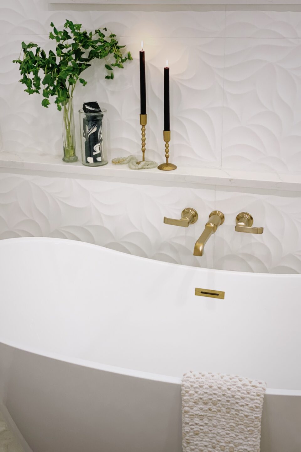 Bathtub With Towel Draped Over Edge