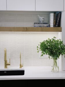 Kitchen With Floating Wood Shelf Over Sink