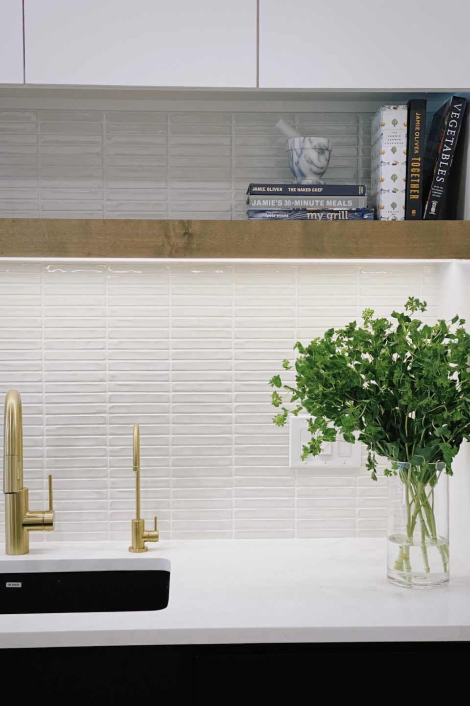 Kitchen With Floating Wood Shelf Over Sink