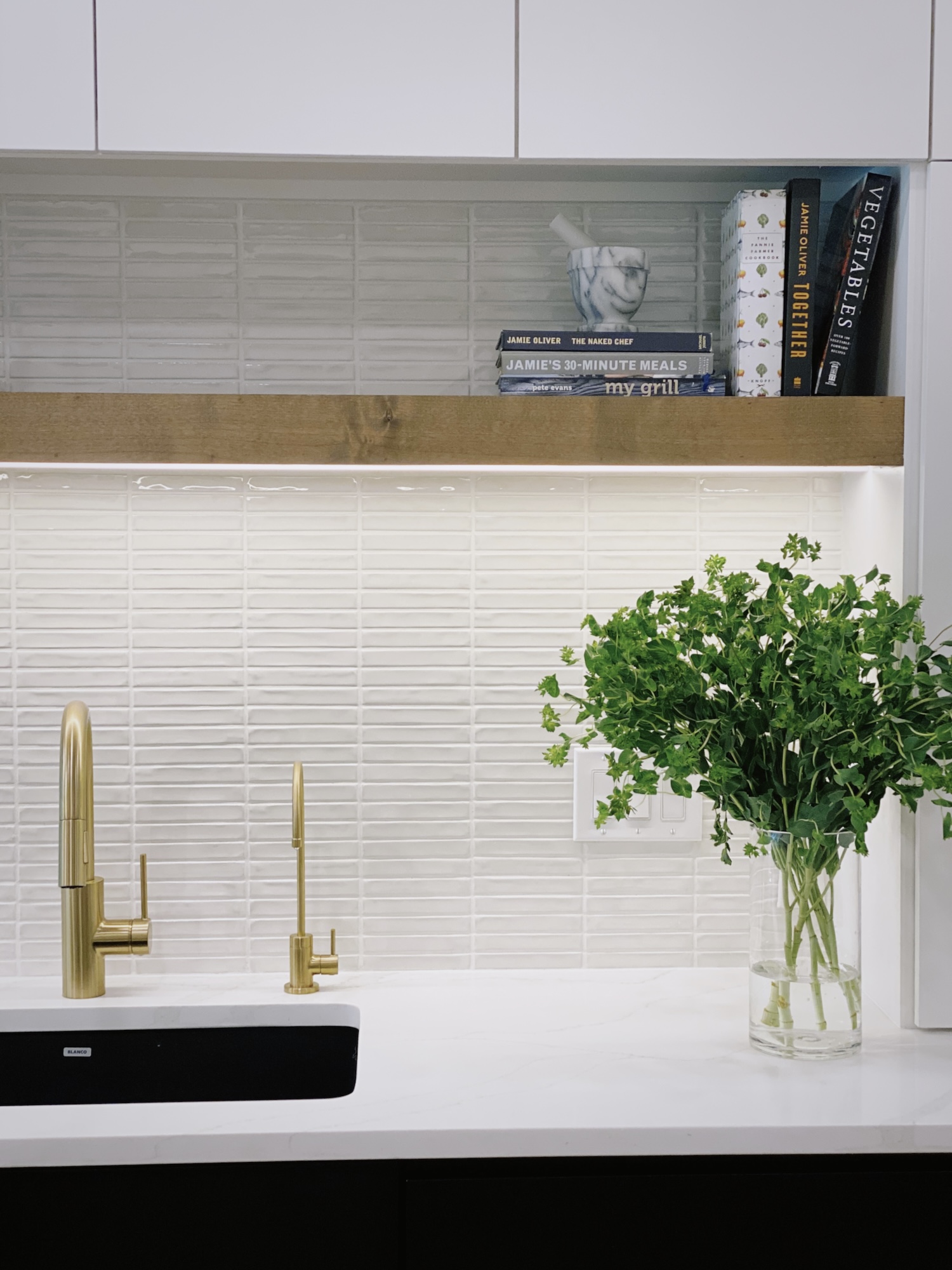 Kitchen With Floating Wood Shelf Over Sink