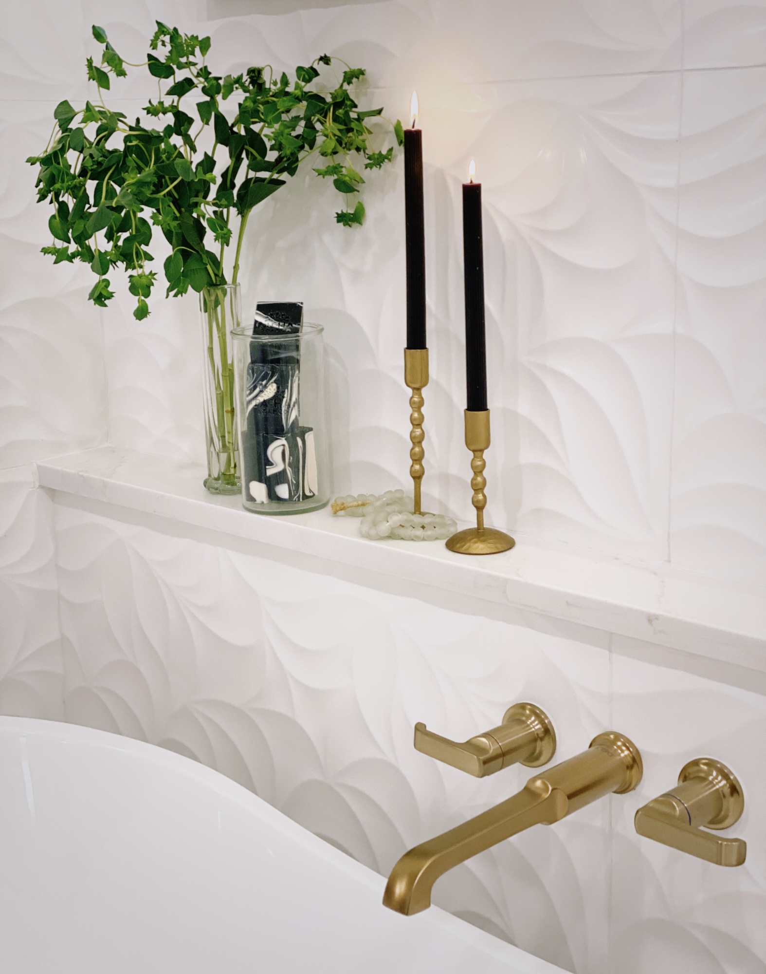 Small Ledge By Bathtub With Lit Candles