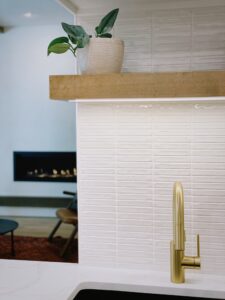 White Tile Blacksplash And Floating Wood Shelf Kitchen
