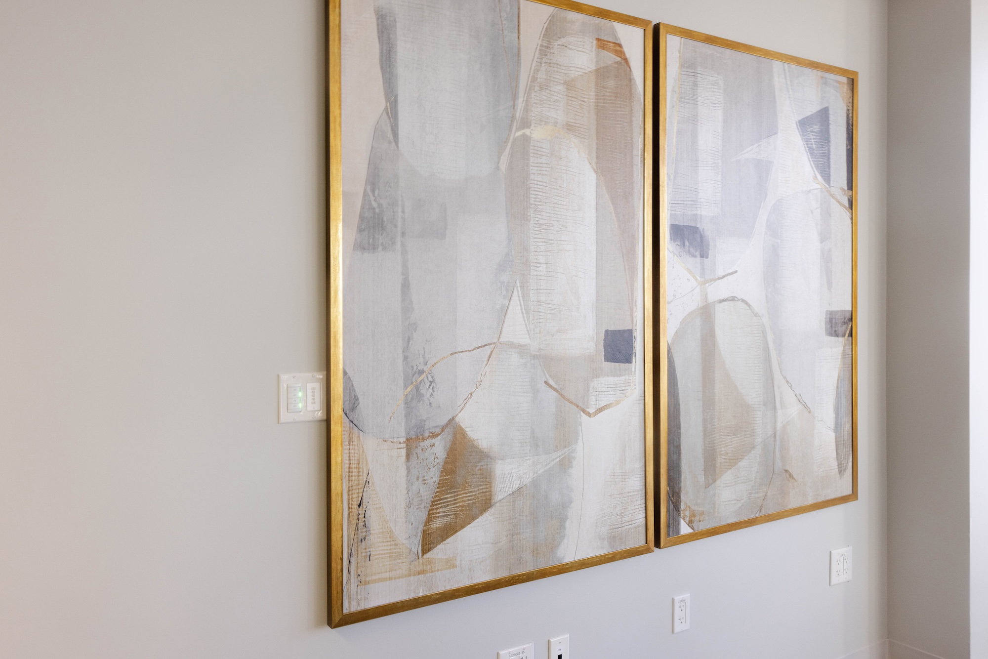 Gold Framed Wall Art In Commercial Office Building